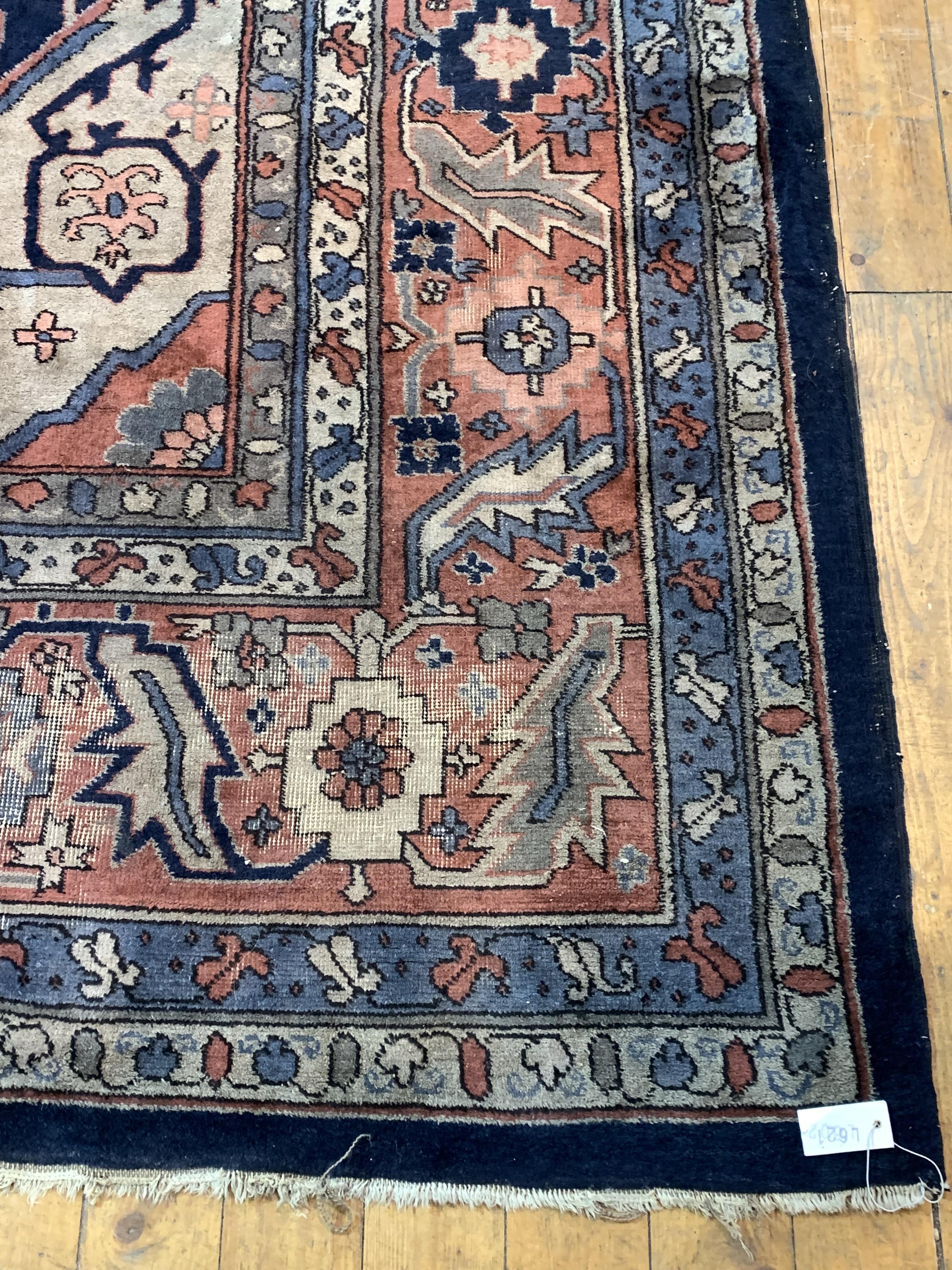 A Large Persian hand knotted carpet, the blue field decorated with geometric foliate framed within a - Image 2 of 5