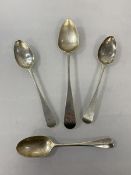 A silver spoon, Newcastle 1819, initial to handle, (17cm) a silver spoon, London 1919, and two white