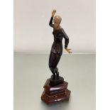 After Preiss, a bronze and resin and metal mounted Dancing Female Figure, on shaped polished agate