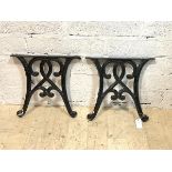 A pair of cast iron garden table ends, H39cm, W41cm