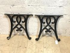 A pair of cast iron garden table ends, H39cm, W41cm