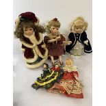 A collection of dolls including a Leonardo Collector's porcelain doll, seated girl with wings (