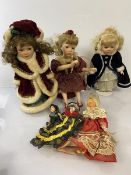 A collection of dolls including a Leonardo Collector's porcelain doll, seated girl with wings (