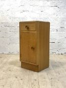 Meredew, A mid century light oak veneered bedside cupboard, with drawer and cupboard, H65cm,