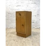Meredew, A mid century light oak veneered bedside cupboard, with drawer and cupboard, H65cm,