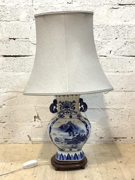 A blue and white ceramic table light in the form of a vase, with shade, H78cm