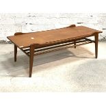 A Vintage mid century teak coffee table, the rectangular top raised on square tapered supports