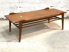 A Vintage mid century teak coffee table, the rectangular top raised on square tapered supports