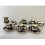 A set of five 19thc. Booths demi tasse cups and six saucers with floral, bird and inset decoration