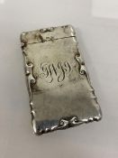 A silver card case, Birmingham 1903, with initials to front and scrolls to edges, (9cm x 5cm) weighs