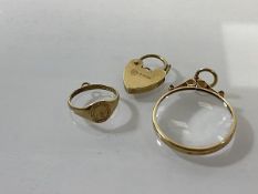 A group of charms including locket, signet style ring and magnifying glass (d.2.5cm), all marked 9k
