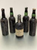 A bottle of Porto Quinta das Carvalhas vintage port 1970 and four various bottles of sealed port, no