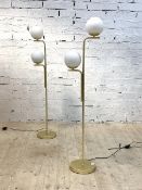 A pair of contemporary gilt brass standard lamps, each with two frosted glass globe shades, H143cm
