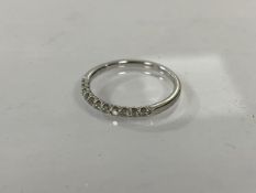 A 9ct gold half eternity ring with diamonds, size O/P, weighs 1.69 grammes