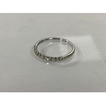 A 9ct gold half eternity ring with diamonds, size O/P, weighs 1.69 grammes