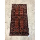 A Persian design runner rug with lozenge motif, 136cm x 68cm