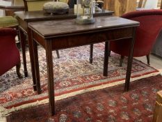 A 19thc mahogany tea table the fold over top with moulded edge above plain frieze on gateleg