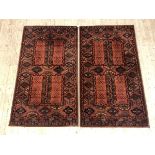 A pair of Persian design rugs with lozenge motif, 160cm x 86cm