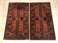 A pair of Persian design rugs with lozenge motif, 160cm x 86cm