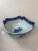 A Chinese blue and white bowl, depicting traditional landscapes, of square scalloped form (13cm x