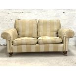 Duresta, A traditional two seat sofa, upholstered in a striped pale gold and ivory chinelle type