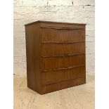 A mid century teak chest, fitted with four drawers with pierced handles, H84cm, W74cm, D41cm