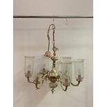 A Dutch style cast brass six branch chandelier with glass shades (lacking one shade) W66cm