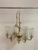 A Dutch style cast brass six branch chandelier with glass shades (lacking one shade) W66cm