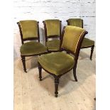 A set of four mid 19th century mahogany side chairs with scrolled backs having moulded edges on