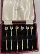 A set of six gilt silver cocktail sticks, Birmingham 1959, each with a rooster finial, in original