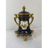 A late 19thc/early 20thc Coalport two handled jar, the lid with finial (tip chipped), with lion