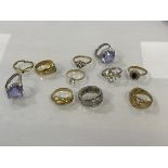 A collection of costume jewellery rings with various settings and sizes, (11)
