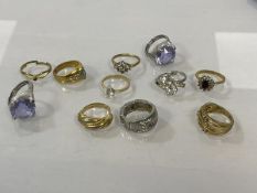 A collection of costume jewellery rings with various settings and sizes, (11)