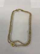 A 9ct gold curb link chain (26cm) weighs 6.05 grammes