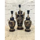 A large Vienna style blue and gilt ceramic twin handled urn shaped table light, (H58m) together with