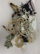 A collection of costume jewellery including a necklace with large pendant by Sempre, faux pearls,