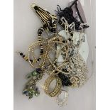 A collection of costume jewellery including a necklace with large pendant by Sempre, faux pearls,