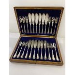 An early 20thc canteen with set of twelve Epns fish knives and forks, each with handle with initial,