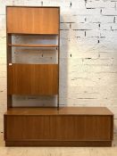 G-Plan, a mid century teak side cabinet, the raised back with cupboard, open shelf and fall front