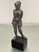 A 1960s style cast metal standing figure on painted treen base (31cm x 12cm)