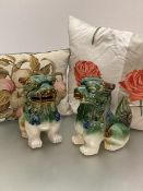 A pair of modern ceramic temple dogs decorated with green and brown glaze (h.26cm x 20cm x 12cm),