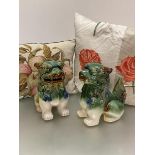A pair of modern ceramic temple dogs decorated with green and brown glaze (h.26cm x 20cm x 12cm),