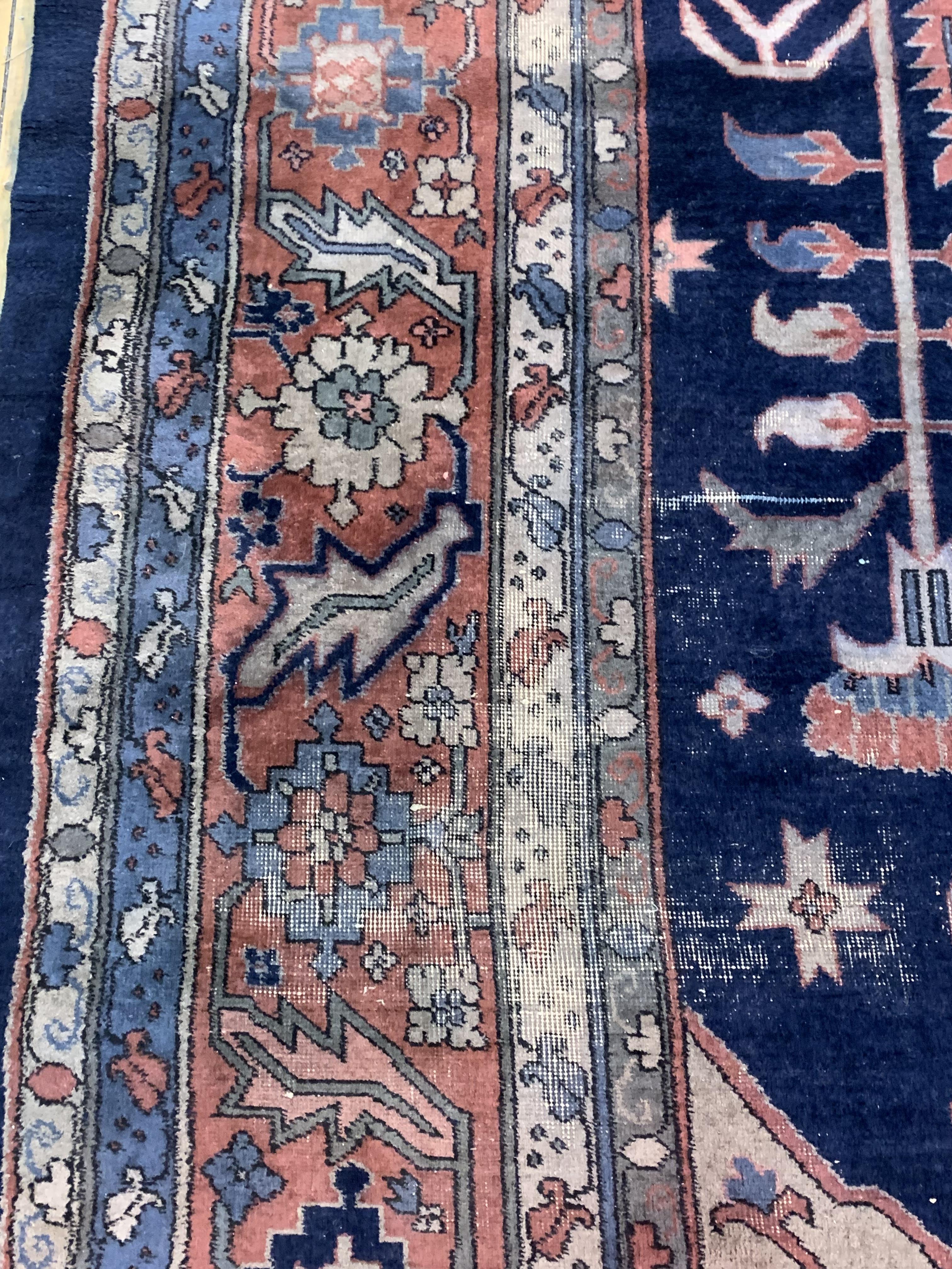 A Large Persian hand knotted carpet, the blue field decorated with geometric foliate framed within a - Image 3 of 5