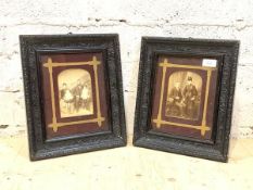 A pair of late 19th century family portrait photographs, in ebonised floral composition moulded