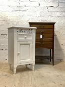 A white painted bedside cabinet, with drawer and cupboard raised on turned supports (H71cm, W41cm,