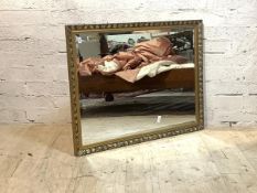 A gilt composition framed wall mirror with bevelled plate, 112cm x 87cm