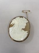 A 9ct gold mounted cameo brooch with safety chain, (5cm x 3.5cm)