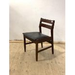 A mid century teak chair, with vinyl upolstered seat raised on square tapered supports, H73cm, W50cm