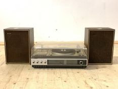 A Philips stereo, with turn table, tape deck and a pair of box speakers, W53cm