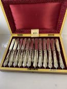 An early 20thc Walker & Hall canteen containing Epns set of 12 knives and forks, (6cm x 35cm x